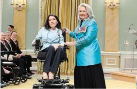  ?? PATRICK DOYLE THE CANADIAN PRESS ?? Maayan Ziv, founder of AccessNow, is presented with the Meritoriou­s Service Cross by Gov. Gen. Mary Simon during a ceremony on Wednesday at Rideau Hall in Ottawa.