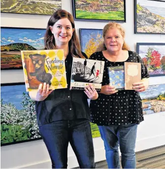  ?? HEATHER LAURA CLARKE ?? Truro librarians Sarah Wood and Lesley Brann of the Colchester-east Hants Public Library have each recommende­d three books for adults and children to read ahead of Remembranc­e Day.