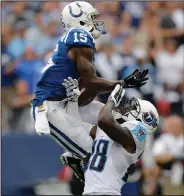  ?? AP PHOTO ?? Indianapol­is Colts wide receiver Phillip Dorsett catches a 35-yard touchdown pass as he is defended by Tennessee Titans strong safety Marqueston Huff.