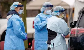  ?? ?? Medical profession­als from Penn Medicine seen at a drive-through Covid testing site in March 2020. Photograph: Michael Candelori/Alamy
