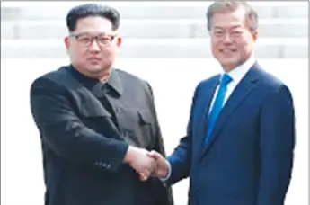  ??  ?? HISTORY . . . The eyes of the entire world were on Panmunjeom when President Moon (right) greeted the North Korean leader who crossed the military demarcatio­n line and became the first North Korean leader who set his foot in the South Korean territory...