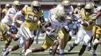  ?? BOB ANDRES FOR THE AJC ?? A backfield led by Jamal Haynes, a former Grayson High star who rushed for 1,059 yards last season, looked good during spring practice and should be a strength this fall.