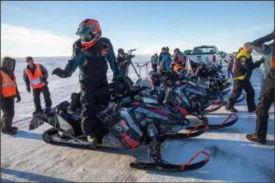  ??  ?? SLED PARKING – The close competitio­n with teams arriving in quick succession turned the Nome-Council Highway into a parking lot.