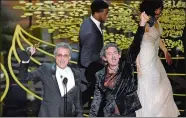  ?? CHRIS PIZZELLO/INVISION/AP ?? Mark Mangini, left, and David White accept the award for best sound editing for “Mad Max: Fury Road” at the Oscars on Sunday in Los Angeles.