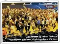  ??  ?? Admiral staff tryto beat the world record for the number of people hopping in one place