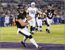  ?? THE ASSOCIATED PRESS ?? Baltimore Ravens wide receiver Michael Campanaro (12) lands in the end zone for a touchdown on a pass reception during Saturday’s game against the Indianapol­is Colts.