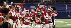  ?? MICHAEL AINSWORTH — THE ASSOCIATED PRESS ?? Oklahoma team members on the sideline celebrate with linebacker Brian Asamoah (24) after Asamoah tackled Florida wide receiver Rick Wells short of the end zone on a fourthdown play during the 2020Cotton Bowl.