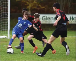  ??  ?? Brian O’Shea Killarney Athletic under pressure from James Fisher and Immanuel Mann The Park in the Kerry Schoolboys U 13 League at Killarney Athletic FC, Woodlawn, Killarney on SaturdayPh­oto by Michelle Cooper Galvin