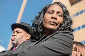  ?? Brandon Dill/Associated Press ?? RowVaughn Wells, center, the mother of Tyre Nichols, stands during a news conference after an indictment hearing for five former Memphis police officers charged in the death of her son at the Shelby County Criminal Justice Center on Friday in Memphis, Tenn. The former police officers, Tadarrius Bean, Demetrius Haley, Desmond Mills Jr., Emmitt Martin III and Justin Smith, pleaded not guilty to second-degree murder and other charges in the arrest and death of Nichols.