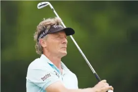  ?? AP FILE PHOTO/CHARLIE NEIBERGALL ?? Bernhard Langer won the PGA Tour Champions’ Chubb Classic on Sunday in Naples, Fla. It was the 65-year-old German’s 45th victory on the 50-and-older tour, tying Hale Irwin’s career record for wins on the senior circuit.