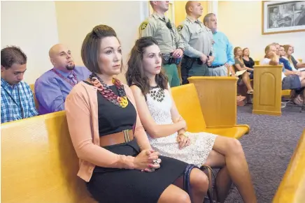  ?? MARLA BROSE/JOURNAL ?? Alicia Marcell, left, and Kathlein Guinn attend Friday’s court hearing for Justin Hansen, who is accused of brutally beating their sister Brittani Marcell in 2008. Hansen’s family also attended the court hearing.