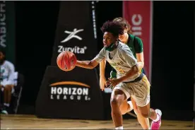  ?? BRIAN DRUMM / HORIZON LEAGUE ?? Wright State’s Emani Jefferson brings the ball up court in Monday’s Horizon League semifinal game against Cleveland State.