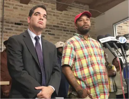  ?? | SUN- TIMES FILE PHOTO ?? Attorney Joshua Tepfer ( left) looks on as his client Leonard Gipson recounts in September how disgraced Chicago Police Sgt. Ronald Watts planted drugs on him three times after Gipson refused to pay Watts bribes.