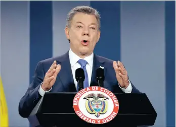  ?? PICTURE: AP ?? Colombia’s president Juan Manuel Santos delivers a statement to the press after meeting with former president Alvaro Uribe and other opposition leaders at the presidenti­al palace in Bogota, Colombia, this week. Santos has won the Nobel Peace Prize.