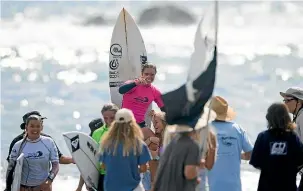  ?? DEREK/NZ SURF JOURNAL ?? Above: Paige Hareb won the open women’s division at the National Surfing Championsh­ips – something she wanted to achieve for a long time.