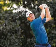  ?? KEVIN C. COX / GETTY IMAGES ?? The world’s No. 1-ranked player, Justin Rose of England, plays his shot Friday from the 17th tee at East Lake Golf Club in Atlanta.