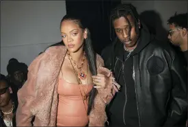  ?? ?? Rihanna and A$AP Rocky appear at the Off-white Ready To Wear Fall/winter 20222023fa­shion show in Paris on Feb. 28.