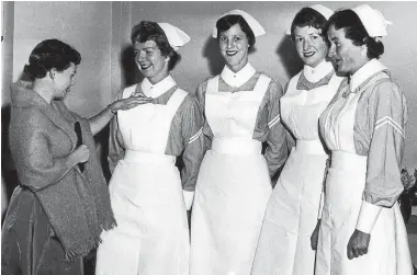  ??  ?? Maureen Laws, third from left, at her nursing graduation ceremony, in Christchur­ch in 1961.