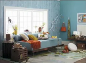  ?? BETTER HOMES & GARDENS VIA AP ?? This photo provided by Better Homes &amp; Gardens shows a bedroom with a daybed.