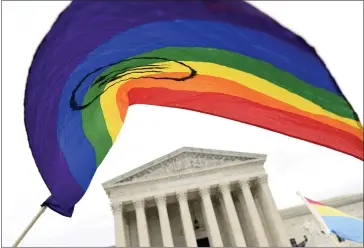  ?? ASSOCIATED PRESS FILE PHOTO ?? Protesters gather outside the Supreme Court in Washington where the Supreme Court is hearing arguments in the first case of LGBT rights since the retirement of Supreme Court Justice Anthony Kennedy, in 2019. As vice president in 2012, Joe Biden endeared himself to many LGBTQ Americans by endorsing same-sex marriage even before his boss, President Barack Obama. Now, as president-elect, Biden is making sweeping promises to LGBTQ activists, proposing to carry out virtually every major proposal on their wish lists.