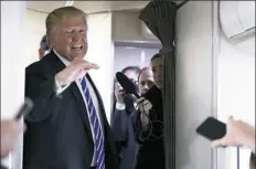  ??  ?? President Donald Trump denied having any knowledge of a payment to Stormy Daniels while speaking with reporters aboard Air Force One on April 5.
