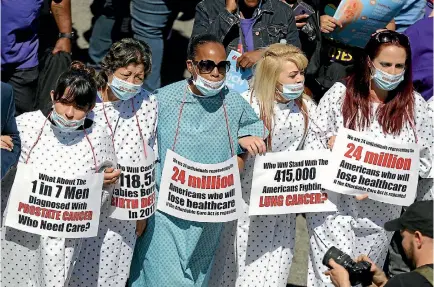  ?? PHOTO: REUTERS ?? People march in a Save Obamacare rally on the seventh anniversar­y of Obamacare’s signing, in Los Angeles.