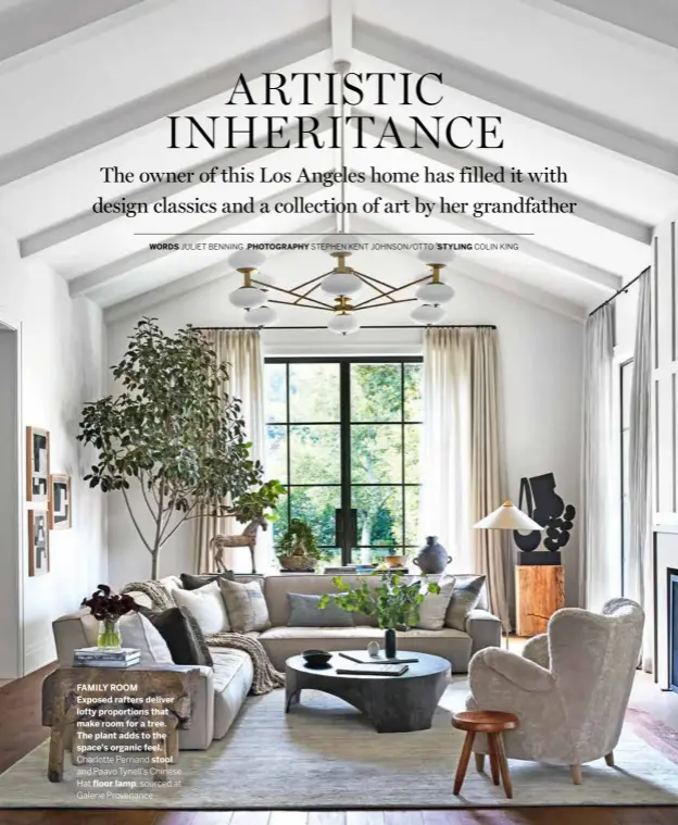  ?? PHOTOGRAPH­Y STEPHEN KENT JOHNSON/OTTO STYLING COLIN KING ?? FAMILY ROOM
Exposed rafters deliver lofty proportion­s that make room for a tree. The plant adds to the space’s organic feel.
Charlotte Perriand stool and Paavo Tynell’s Chinese Hat floor lamp, sourced at Galerie Provenance