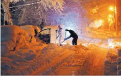  ?? BOB KARP/THE RECORD ?? Residents on Mills Street dig out their car after a snowstorm dumped over a foot of snow around the area Wednesday, in Morristown, N.J.