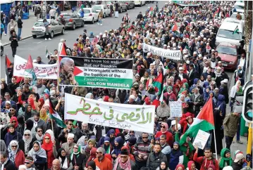  ?? PICTURE: NOOR SLAMDIEN ?? IN SOLIDARITY: Thousands of protesters marched through the streets of Cape Town yesterday to highlight Israeli-imposed security measures at the al-Aqsa Mosque in Jerusalem. They were joined by Mandla Mandela, the grandson of Nelson Mandela.