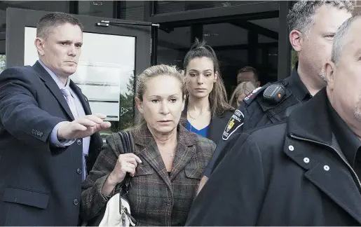  ?? Marta
Iwan
ek / THE CANADIAN PRESS ?? Dawn Muzzo, second from left, exits the courthouse Friday in Newmarket after a hearing for her son Marco Muzzo, who is accused in an impaired-driving incident that killed a man and his three grandchild­ren. He has a bail hearing on Oct. 19.