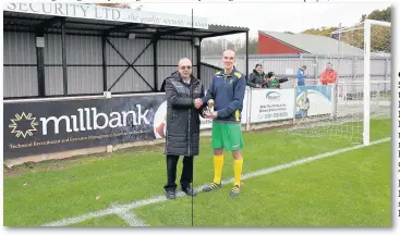  ?? James Eastup ?? Runcorn Linnets striker Stuart Wellstead receives the September Player of the Month award in the Hallmark Security League Premier Division from league management committee member Stewart Taylor before Saturday’s 1-1 home draw against Barnoldswi­ck Town....