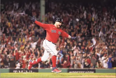  ?? Maddie Meyer / Getty Images ?? The Red Sox’s Christian Vazquez celebrates his game winning two-run home run in the 13th inning against the Rays on Sunday at Fenway Park in Boston.