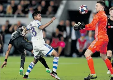  ?? Kent Nishimura Los Angeles Times ?? LAFC GOALIE Tyler Miller gathers the ball as Montreal’s Shamit Shome runs toward him Friday night.