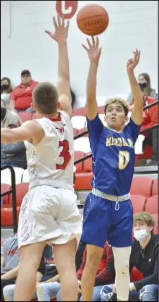  ?? Staff photo/ Jake Dowling ?? St. Marys’ LeTrey Williams attempts a 3- pointer in last week’s Western Buckeye League boys basketball game against Wapakoneta.