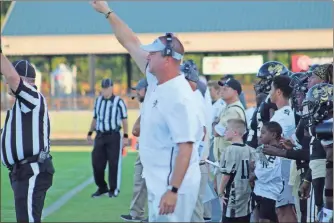  ?? Kevin Myrick ?? Head coach Biff Parson throws up signals for his team as they get ready for a play against Central Carroll in 2019. He’s hopeful the team will be ready for the start of 2020 despite no spring football.
