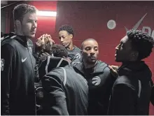  ?? CANADIAN PRESS FILE PHOTO ?? Raptors players huddle outside the locker-room before their NBA game against the Oklahoma City Thunder in Toronto on March 18.
