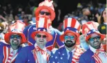  ?? Photos by Mark Ralston / Getty Images ?? The U.S. team was cheered on by Uncle Sams on Friday at a loud AT&amp;T Park.