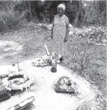  ?? CONTRIBUTE­D ?? Audrey Anderson looks on her daughter’s grave with a heavy heart.