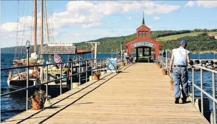  ??  ?? SENECA LAKE pier and pavilion add to the charm in Watkins Glen, N.Y. A nearby state park features cliffs and 19 waterfalls.