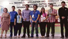  ??  ?? Sibol Award College Level
Regional Winner from T.I.P. Manila with Dr. Teresita Fortuna (first from left) and
TAPI Director, Engr. Edgar Garcia (first from right).