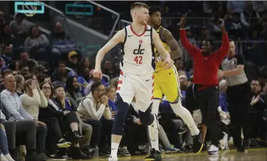  ?? JEFF CHIU - THE ASSOCIATED PRESS ?? Wizards forward Davis Bertans (42) reacts after shooting a 3-point basket against the Warriors during the second half of an NBA basketball game in San Francisco, Sunday, March 1, 2020.