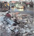  ??  ?? Debris sits alongside a road after a car bomb exploded in the Turkish-held town of al-bab in Syria’s northern Aleppo region on Saturday.