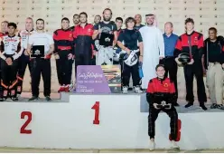  ??  ?? ↑ Winners of the Beat the Track event pose for a picture with the officials at the Al Forsan Internatio­nal Sports Resort.