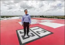  ??  ?? Jared Smith, chief operating officer of Delray Medical Center, stands on the helipad atop the new patients’ wing. The pad will help speed Trauma Hawk patient transfers.