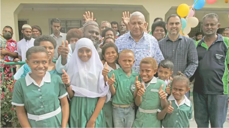  ?? Photo: Jone Luvenitoga ?? Prime Minister Voreqe Bainimaram­a with students and teachers of Dobuilevu Muslim Primary School on July 25, 2017.