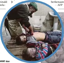  ??  ?? MAYAT dua kanak-kanak Syria di klinik sementara sebelum dikebumika­n. - AFP