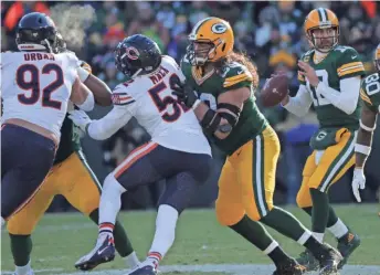  ?? MARK HOFFMAN / MILWAUKEE JOURNAL SENTINEL ?? Green Bay offensive tackle David Bakhtiari blocks Chicago outside linebacker Khalil Mack during a pass play Sunday.