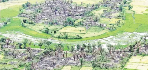  ?? — Reuters photo ?? Aerial view of a burnt Rohingya village near Maungdaw, in the north of Rakhine State, Myanmar is seen in this file photo.