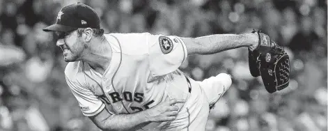  ?? Karen Warren / Staff photograph­er ?? Astros starter Justin Verlander improves to 5-0 this season against the Rangers by throwing six shutout innings Tuesday night.