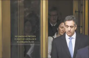  ?? Drew Angerer / Getty Images ?? Michael Cohen exits federal court after his sentencing hearing Wednesday in New York City.